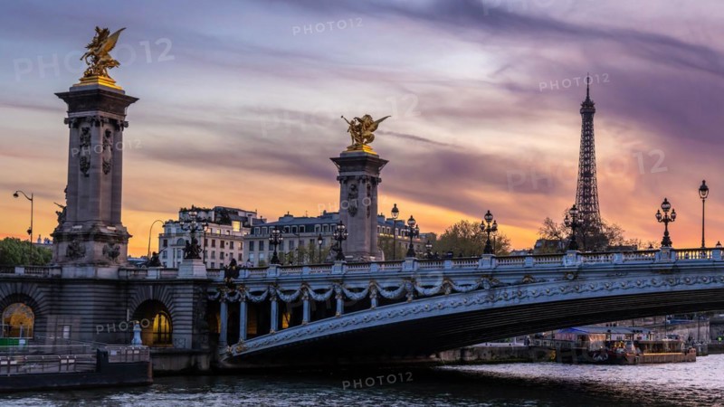 Evening atmosphere in the Seine in Paris with Pont Alexandre III bridge and Eiffel Tower