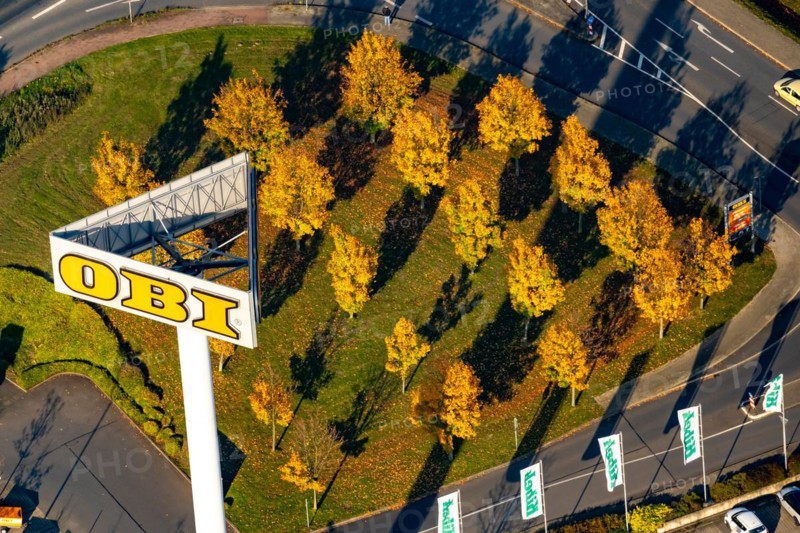 Autumn trees at Obi Markt from the air in Recklinghausen. North Rhine-Westphalia