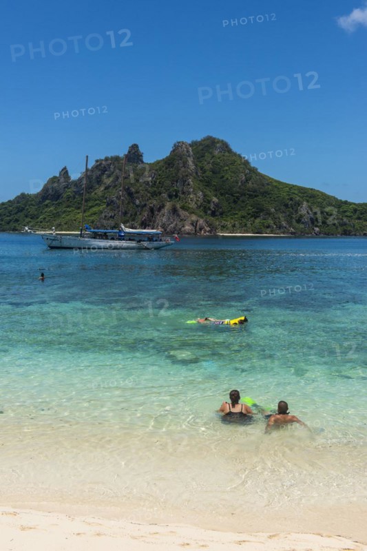 Tourists enjoying the beautiful clear turquoise waters of Monuriki or Cast away island