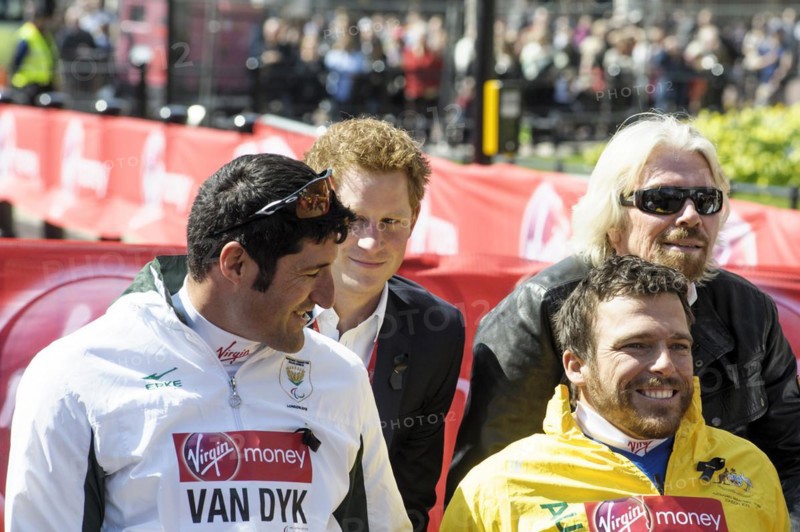 Prince Harry presents a medal to the Mens Elite Wheelchair winner Kurt Fearnley at the Virgin London Marathon Medal Presentations on 21.04.2013 at The Mall