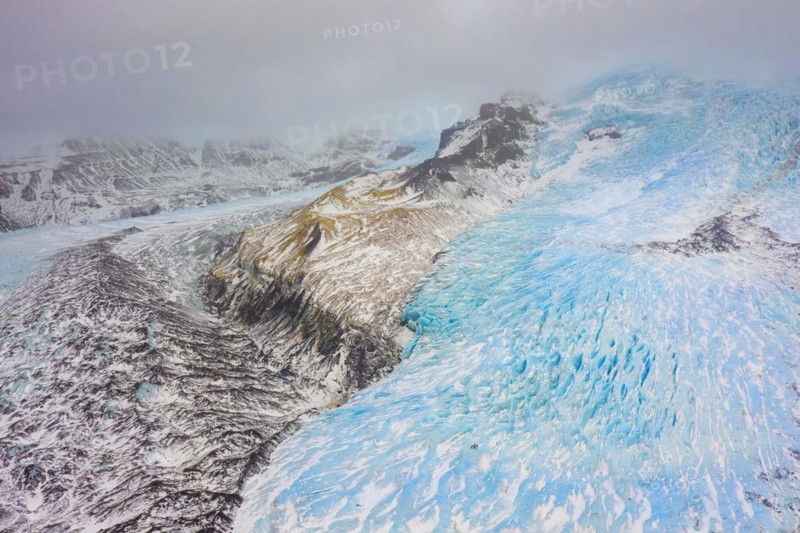 Aerial view in winter over the glacier Falljoekull