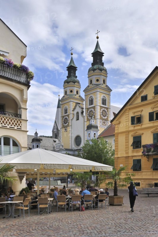 Square with historical houses and the cathedral at Brixen
