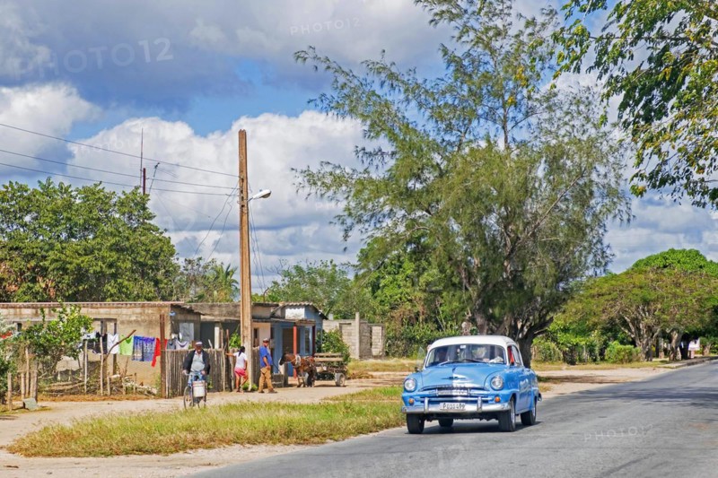 Vintage American classic car driving on the Carretera Central
