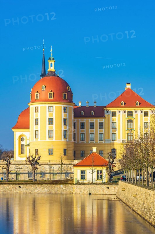 Exterior view of Moritzburg Castle in winter with half-frozen castle pond from the south