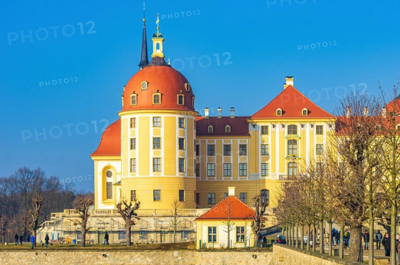 Exterior view of Moritzburg Castle in winter with half-frozen castle pond from the south