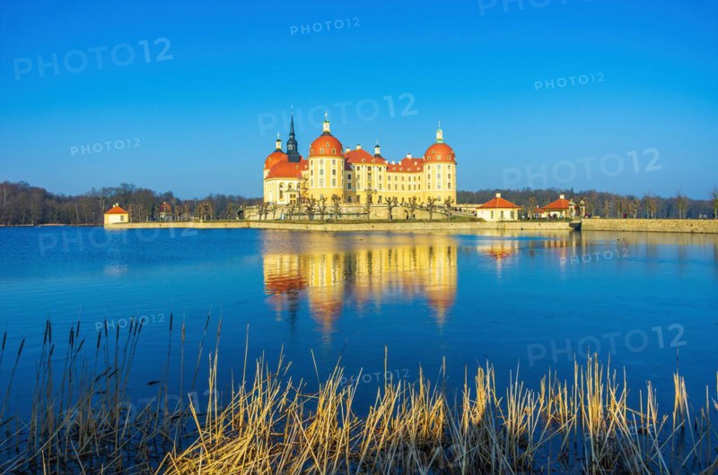 Exterior view of Moritzburg Castle in winter with half-frozen castle pond from the southwest