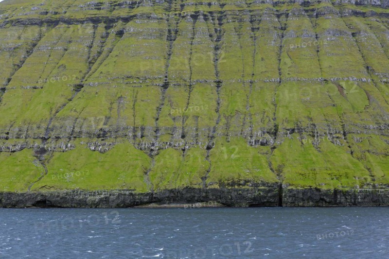 Sea cliffs along the rugged coast of Eysturoy