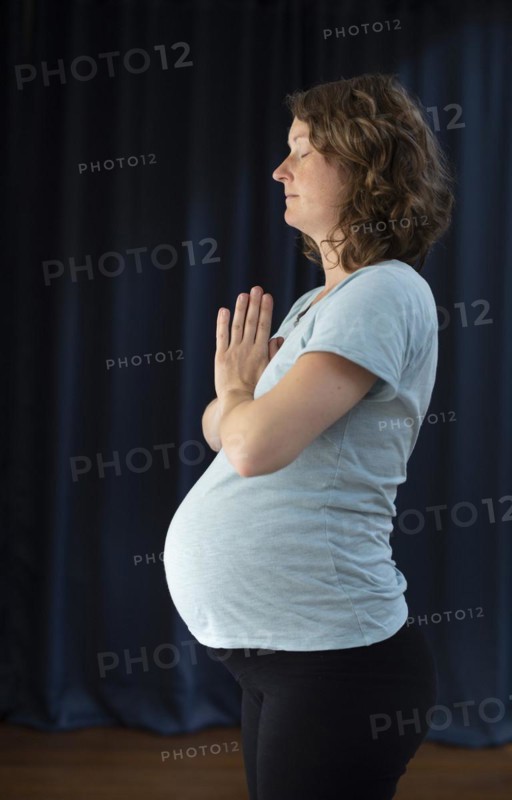Pregnant woman doing yoga