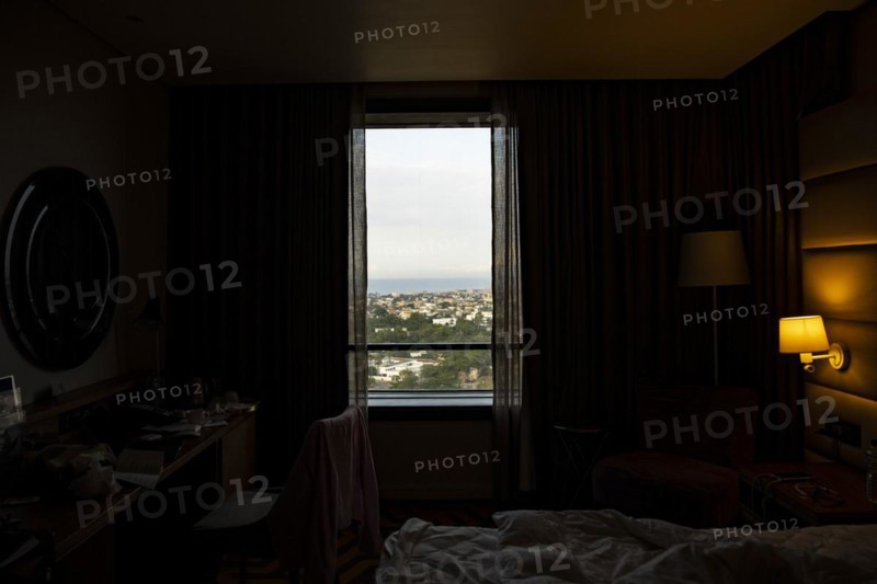 City view of Lome photographed through a window