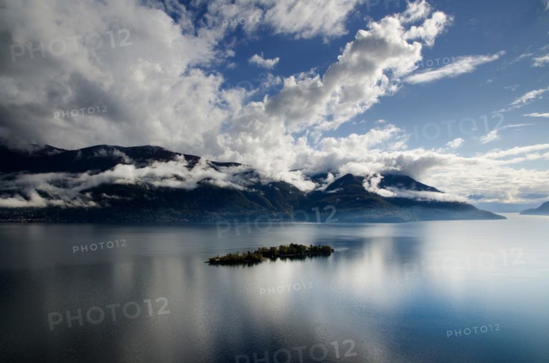 Clouds over Brissago islands on alpine lake Lago Maggiore in Ticino