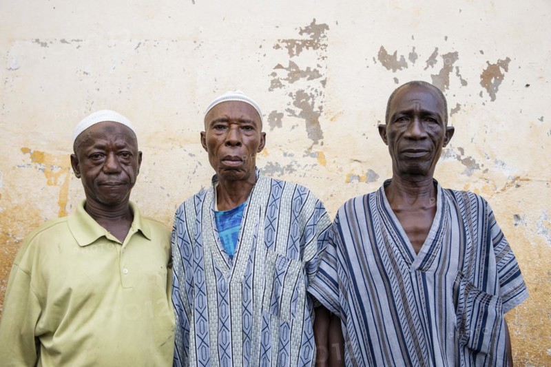 Three men in Bomeh Village at the KissyRoad dumpsite