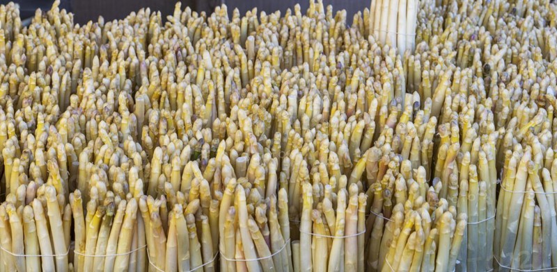 Market stall with fresh asparagus