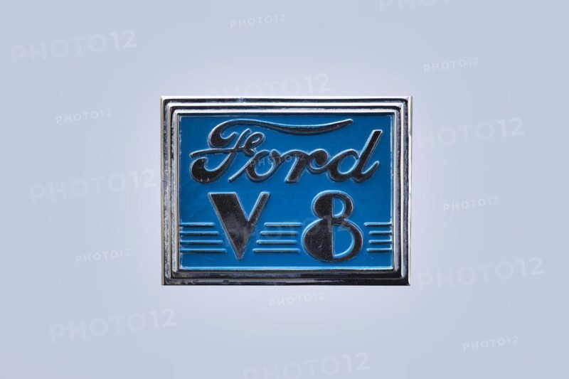 Blue vintage Ford V8 logo
