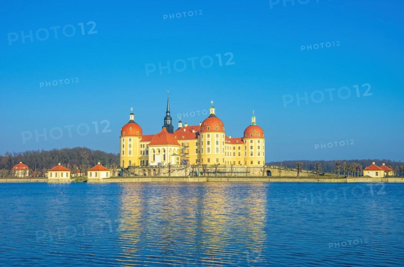 Exterior view of Moritzburg Castle in winter with half-frozen castle pond from the southwest
