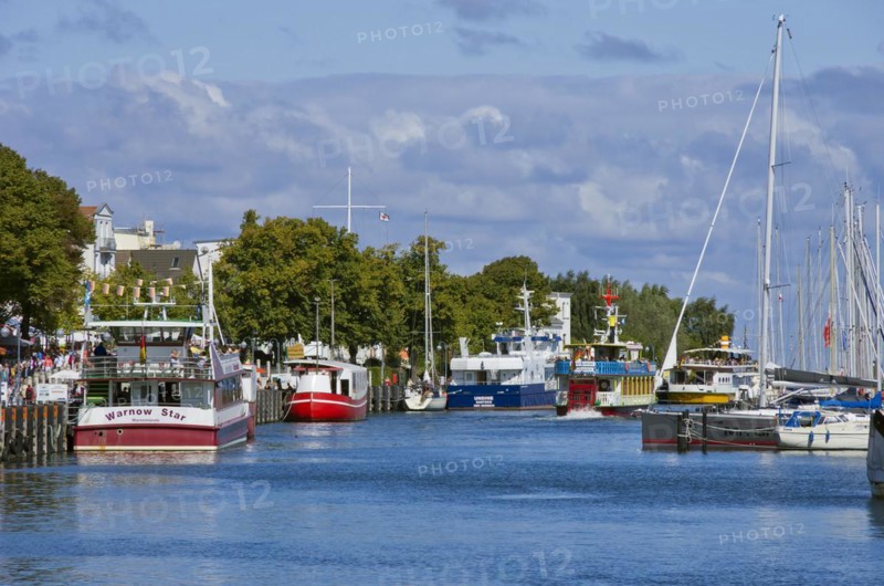 Fishing boats and excursion ships at the Alter Strom in Rostock-Warnemuende