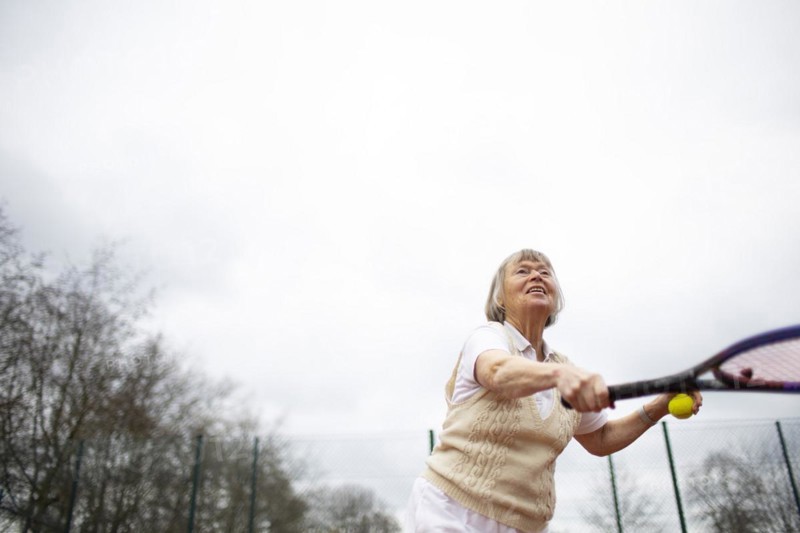 Subject: Woman aged 82 standing on the tennis court