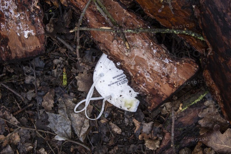 Discarded FFP2 masks lying in nature