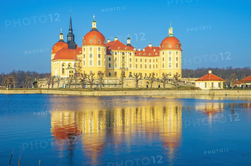 Exterior view of Moritzburg Castle in winter with half-frozen castle pond from the southwest