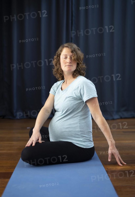 Pregnant woman doing yoga