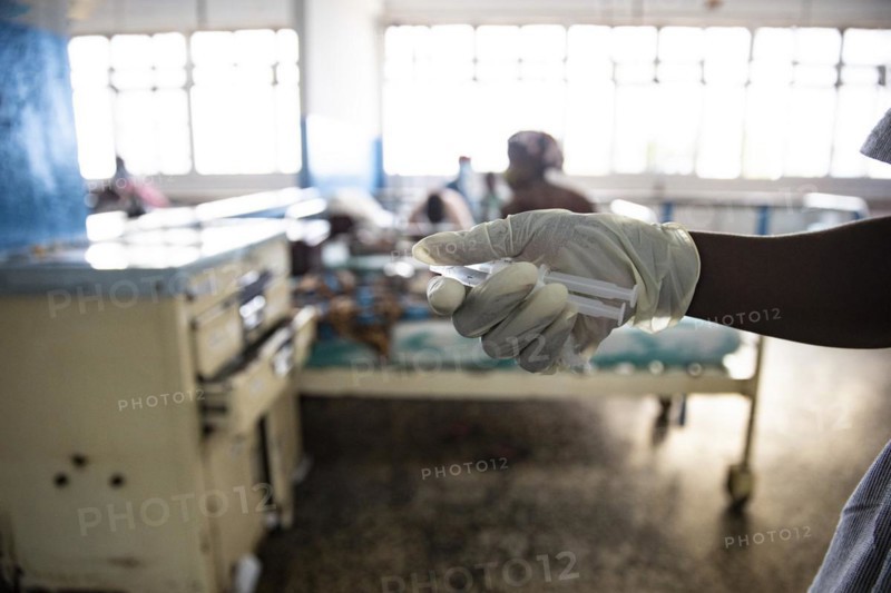 Nurse holding syringes at Princess Christian Hospital in Sierra Leone