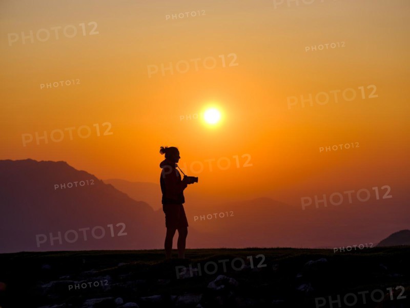 Silhouette of a photographer at sunset
