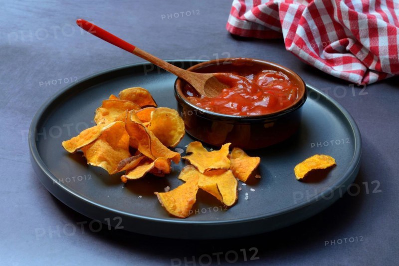Sweet crisps and salsa sauce on plate