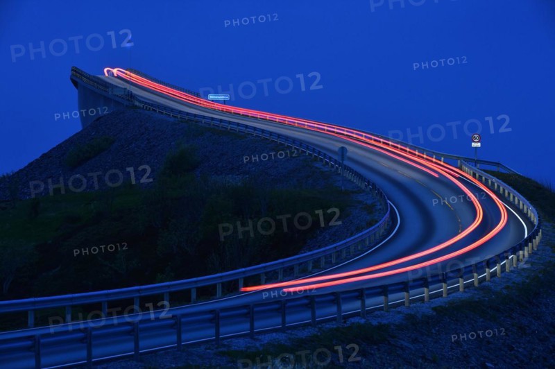 Car taillight on the Storseisund Bridge on the Atlantic Road