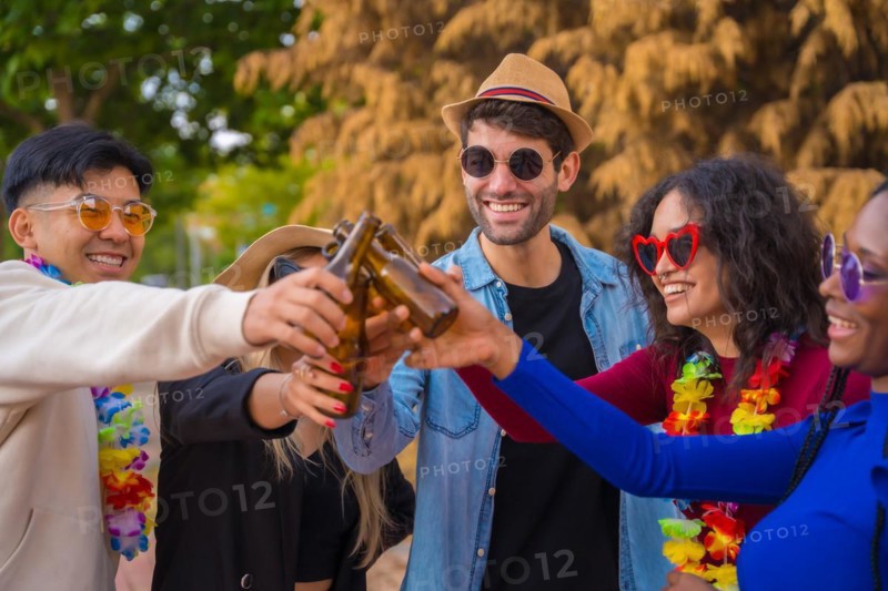 Group of multi ethnic friends partying in a park
