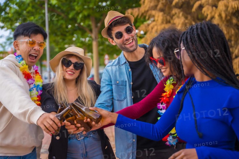 Group of multi ethnic friends partying in a park