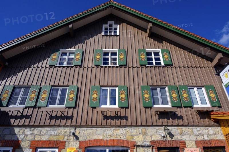 Façade with green shutters