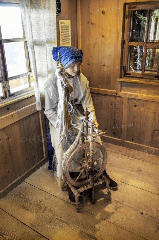 Figure of a flax spinner with spinning wheel