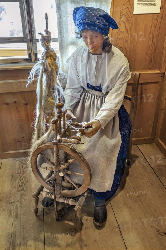 Figure of a flax spinner with spinning wheel