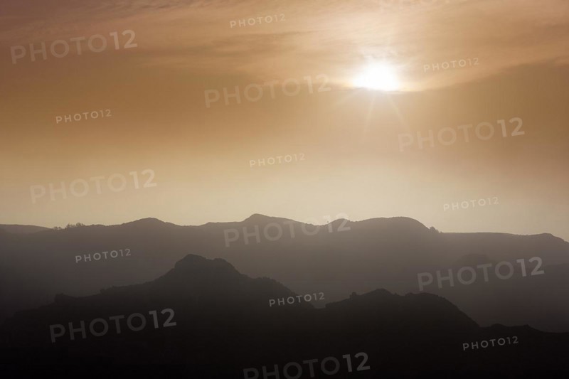 Sunset behind clouds