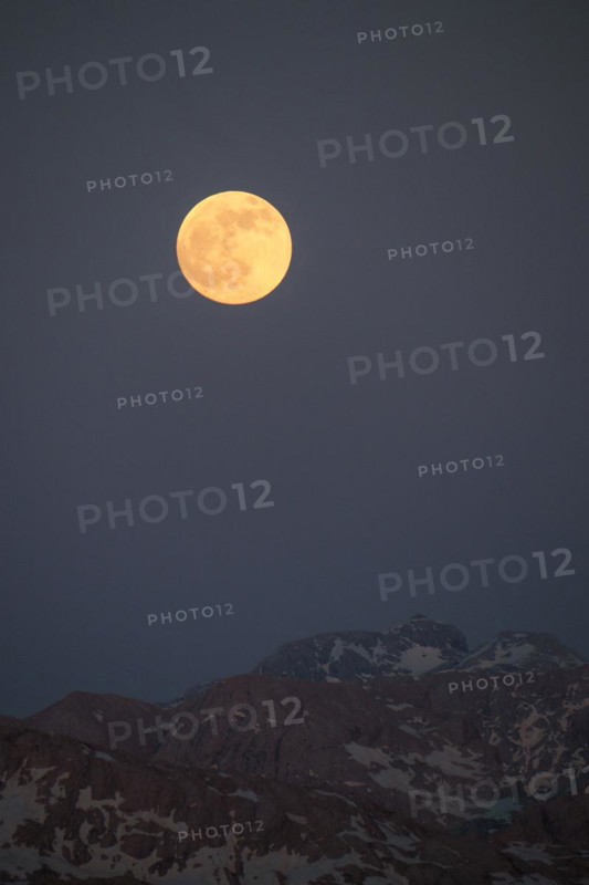 The full moon rises above the Hochkönig and Matrashaus