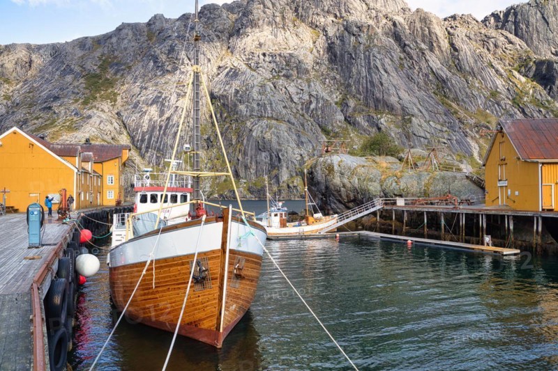 Historic buildings and fishing boats in Nusfjord harbour