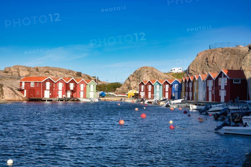 Fishing boats and colourful boathouses in the harbour of Smögen