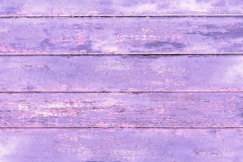 Wooden background with violet painted planks