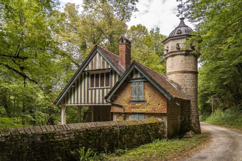 Buillon Castle in Chenecey-Buillon and the River Loue