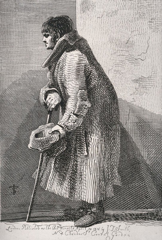 A blind beggar bent over his walking stick and holding out his hat for money