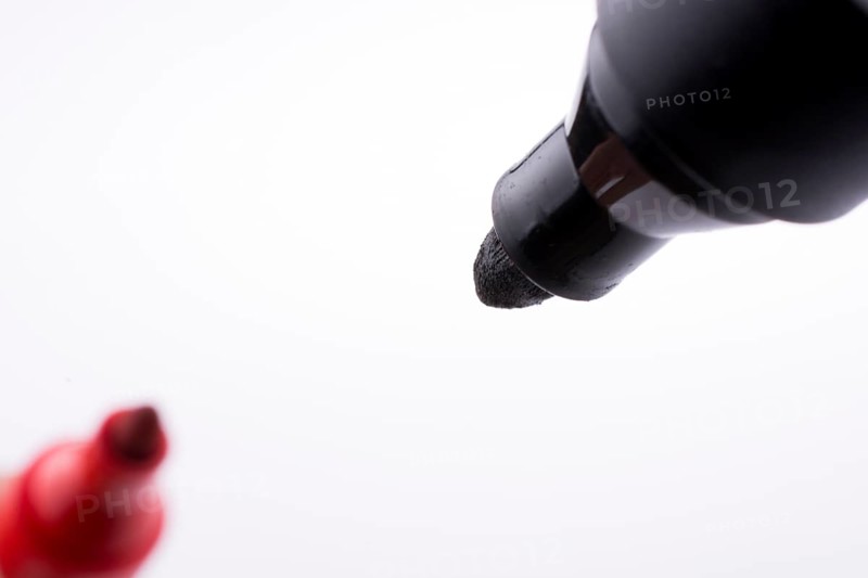 Color markers face to face on a white background