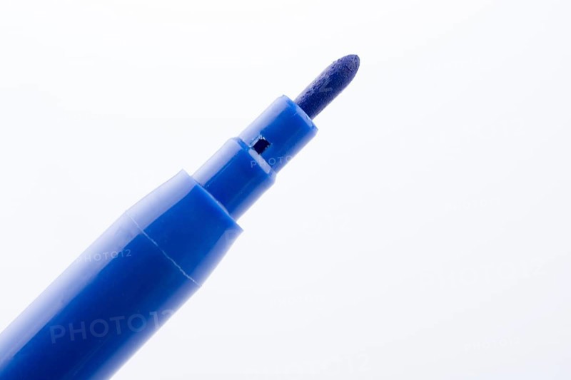 Felt-tip pen of blue color on a white background