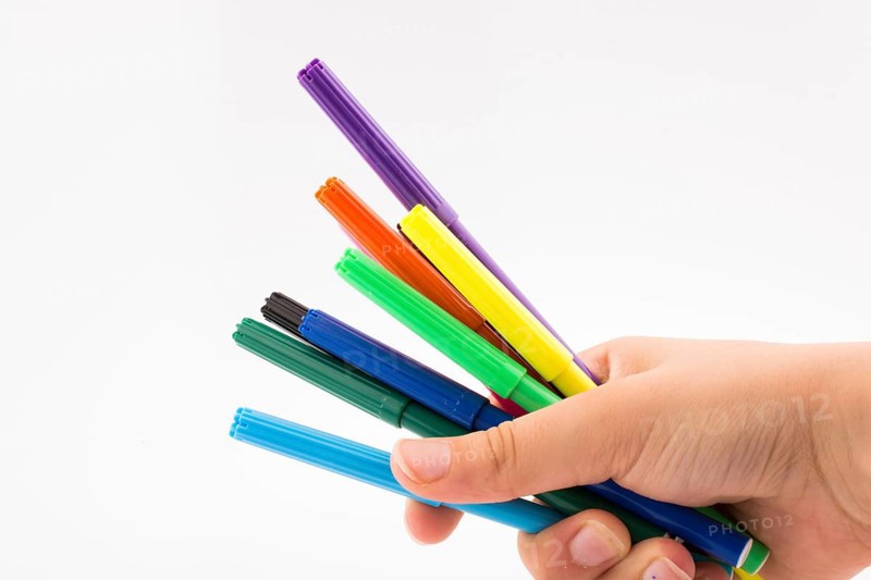 Color felt-tip pens of various color on white background