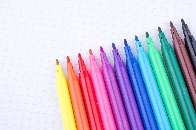 Colorful felt-tip pens on a notebook