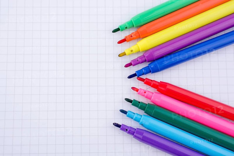 Colorful felt-tip pens on a notebook
