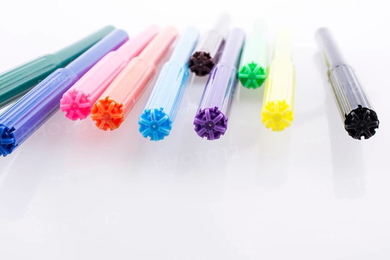 Color felt-tip pens of various color on white background