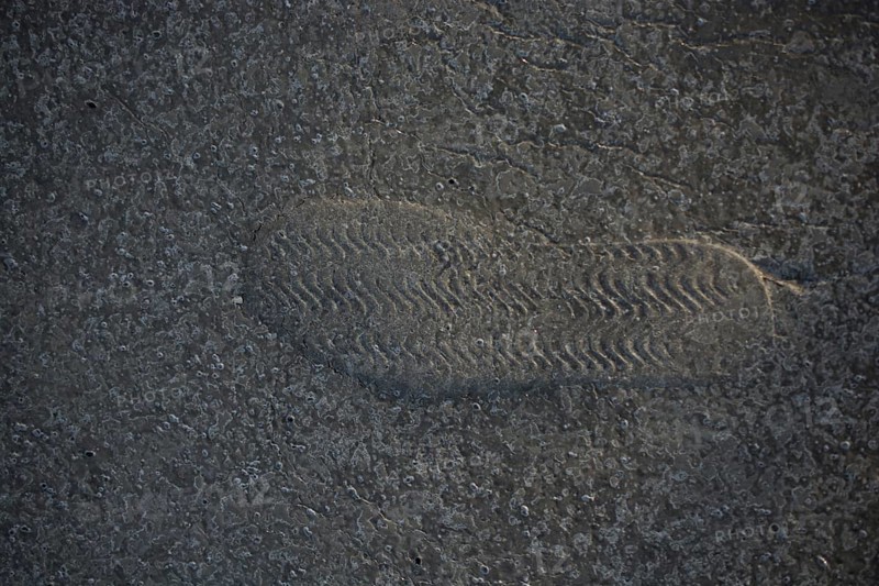 Footstep pattern seen on a concrete background