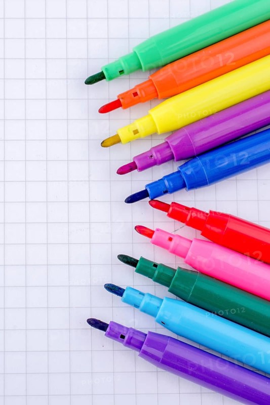 Colorful felt-tip pens on a notebook