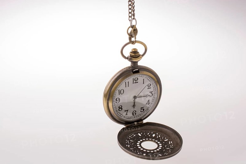 Retro style pocket watch on white background