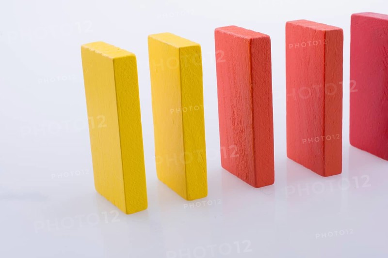 Colorful Domino Blocks in a line on a white background