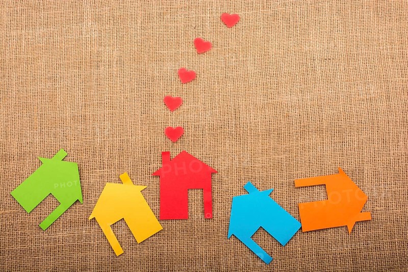 Heart shape coming out of chimney of paper house